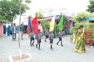 Students marching with flags at the inauguration