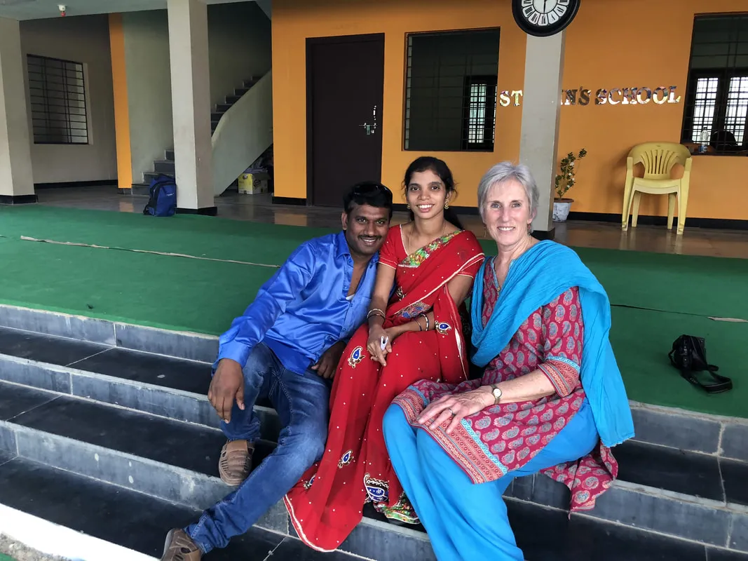 Valerie with a staff couple at St. John's