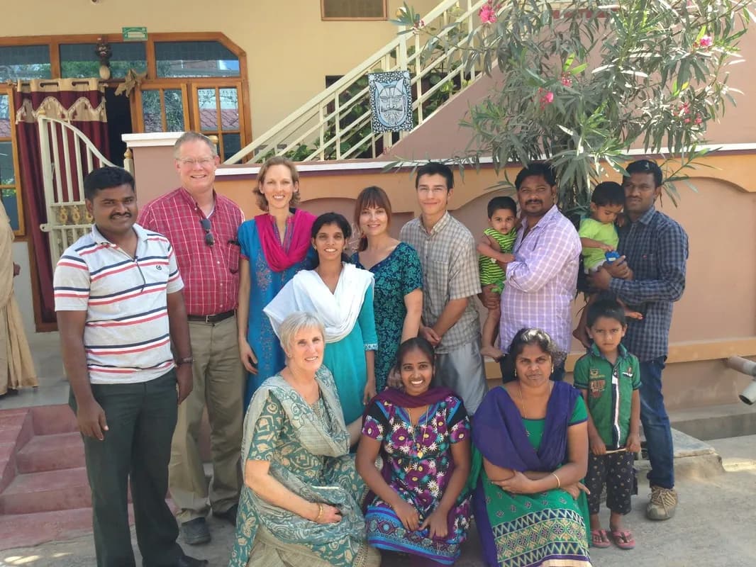 The visiting team of five with a St. John's family