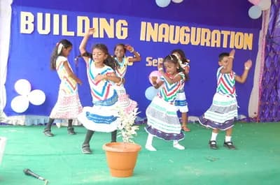 Students performing a dance at the building inauguration
