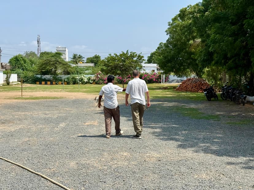 Ray Stark walking the school grounds with staff